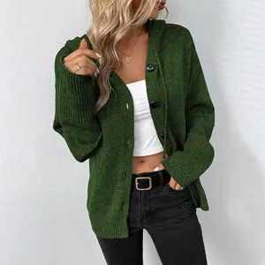 Detailed view of the dark green hooded knit cardigan, showcasing the button closure and texture.
