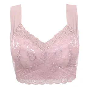Detailed view of pink lace bralette featuring wide straps and delicate floral embroidery.
