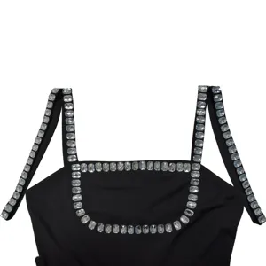 Detailed view of women's black rhinestone embellished camisole strap and sparkling crystal neckline.