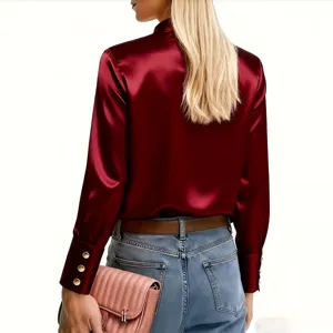 Detailed back view of women burgundy satin long sleeve stand collar shirt with jeans.