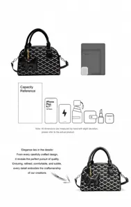 Detail view of black chevron bowling handbag showing spacious capacity and cute dog charm.