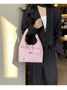 Red and white plaid shoulder bag detail shot, casual hobo tote bag style for women.