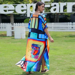 Detail view of colorful abstract printed beach kaftan cover-up dress for women seaside