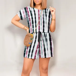 Detailed view of women's tie-dye short sleeve jumpsuit with drawstring waist and crew neck.