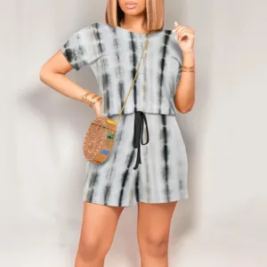 Detailed shot of casual tie-dye short sleeve top and shorts set with drawstring waist.