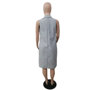 Back detail view of a grey sleeveless woolen mid-length vest jacket, clean plain background.