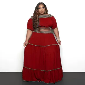 Detail view of the stylish two-piece crop top and maxi skirt set featuring contrasting trim.