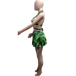Detailed view of the green camouflage print halter top and pleated skirt set, casual style.