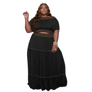 Plus size off shoulder crop top and tiered maxi skirt two piece set in classic black color.