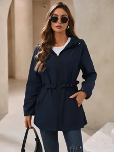 Detailed view of women's navy blue hooded windbreaker jacket with cinched waist and pockets.