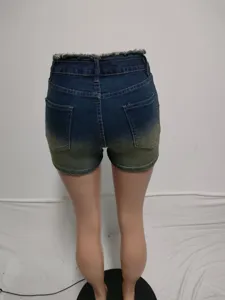 Detail view of women gradient distressed denim shorts, sexy slim fit stretch jean shorts.