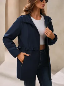 Detailed view of women's navy blue hooded windbreaker jacket with zip pockets and elegant waist.