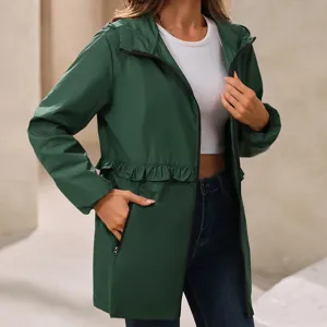 Dark green hooded windbreaker jacket detail, showing zipper pocket and waist ruffle design.