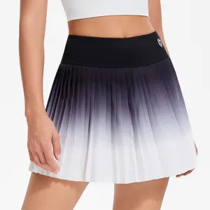 Close-up detail of a stylish black and white gradient pleated tennis skirt with high waist.