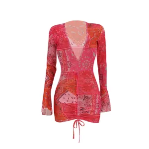 Red paisley print mesh bodycon mini dress with deep V-neck and ruched long sleeves.