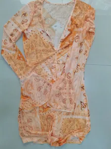 Orange paisley mesh V-neck long sleeve bodycon mini dress fashion detail view