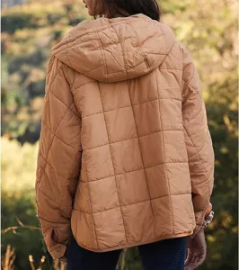 Women's solid color quilted hooded puffer jacket back view detail showcasing warm winter design.