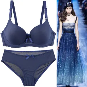 Seamless push-up bra and panties set in deep blue, smooth solid color design with bow.
