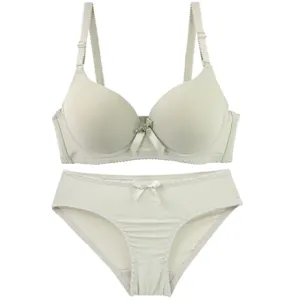 Detailed close-up view of the smooth seamless bra and matching panties with cute bow detail.