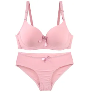 Pink seamless bra and panty set detail view, comfortable daily women lingerie underwear.