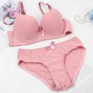 Pink seamless push-up bra and panty lingerie set with cute bow detail, smooth everyday wear.