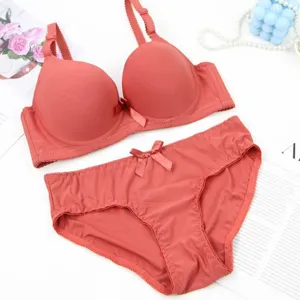 Solid color seamless push-up bra and panties set with cute bow detail for women detail view