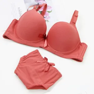 Detail shot of solid color seamless push-up bra and panty set with cute bow decoration.