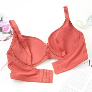 Detail view of the seamless terracotta bra back, showing hook-and-eye closure and straps.