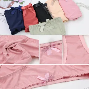 Close up details of seamless women briefs with cute bow, soft fabric and fine stitching.