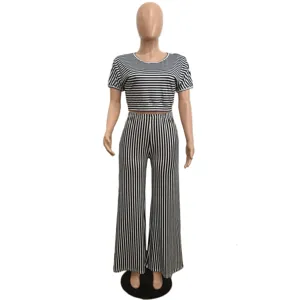 Black white striped two-piece set with short sleeve crop top and high waist wide leg pants.