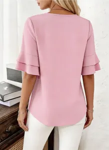 Detail view of the stylish pink short sleeve top with double ruffle cuffs and classic crew neck.
