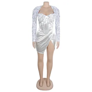 Detail view of the elegant white sequin long sleeve sexy high slit short banquet dress.
