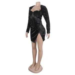 Close-up view of the black sequin sleeve corset dress featuring a stylish slit design.
