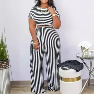 Chic black and white striped two piece set with crop top and high waist wide leg pants.