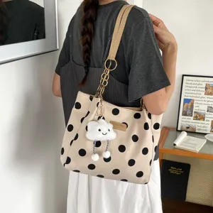 Chic beige polka dot canvas tote bag with gold chain strap and cute cloud plush charm for women.