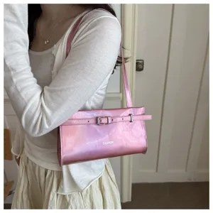 Stylish pink glossy shoulder bag for women, trendy underarm bag with chic belt buckle design.