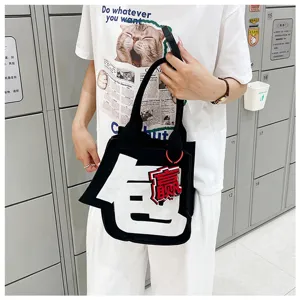 Minimalist black felt tote bag with creative white letter design, stylish daily casual handbag.