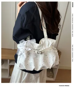 Stylish white shoulder bag with silver star print, sweet lace star charm and trendy buckle strap.