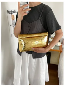 Golden metallic crocodile pattern leather clutch bag, stylish large capacity purse for women.
