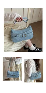 Vintage lichtblauwe denim schoudertas detail, stijlvol metalen riemgesp ontwerp.