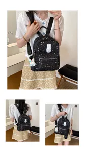 Detailed view of women casual mini backpack with star pattern and cute rabbit patch, sweet style.