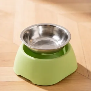 Gamelle pour animaux surélevée avec insert en acier inoxydable amovible et support vert.