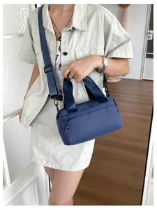 Bolso bandolera cilindrico azul para mujer, bolso casual diario con correa ajustable.