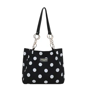 Fashion black polka dot canvas tote bag for women with large capacity casual shoulder bag.