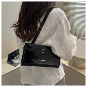 Black patent leather underarm shoulder bag with buckle strap, minimalist design for women daily wear.