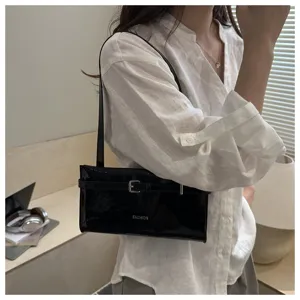 Stylish black patent leather shoulder bag for women, chic minimalist design, daily wear.