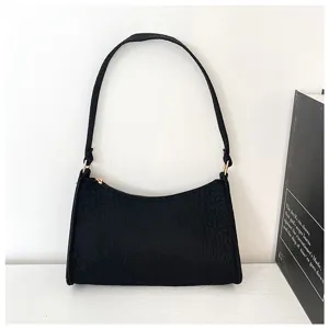 Detailansicht der schwarzen Krokomuster minimalistischen Damen Schultertasche Tasche.