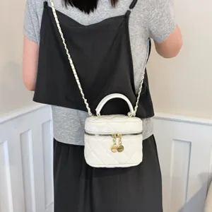 White quilted chain crossbody bag for women, chic minimalist shoulder vanity handbag.