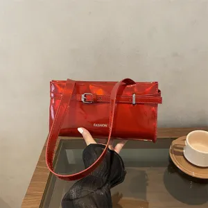 Glossy red patent leather shoulder bag for women, stylish underarm bag with belt buckle.