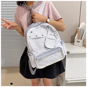 Detail view of a cute ita backpack with transparent pocket and star pattern for students.